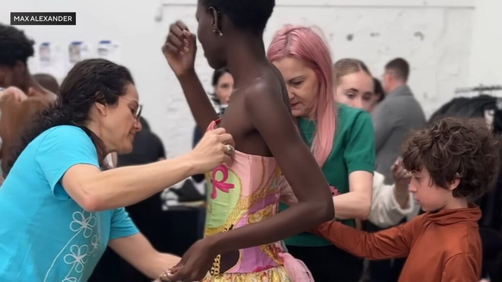 Max Alexander works with his team to perfect a colorful dress ahead of Paris Fashion Week.