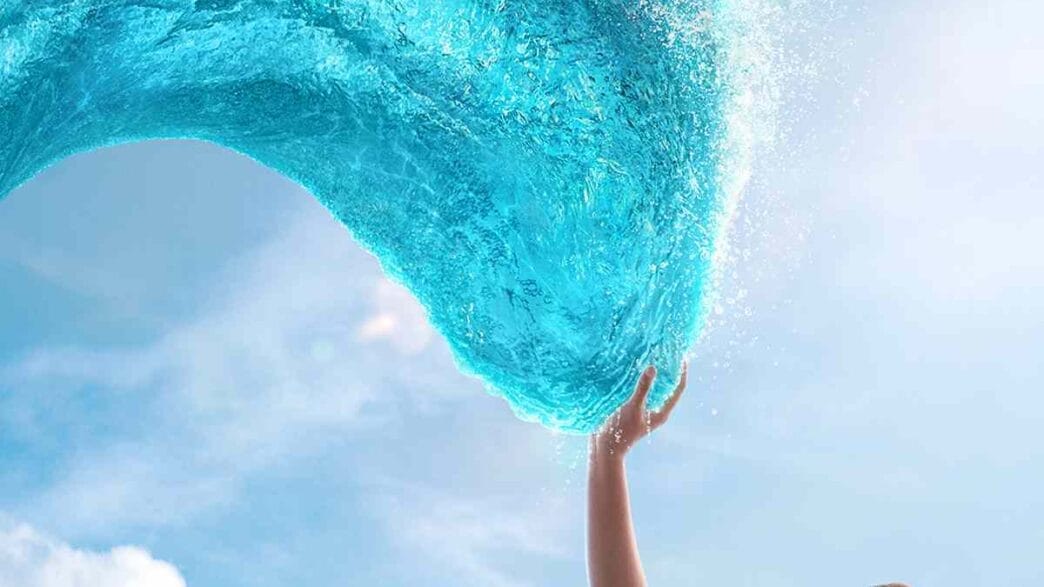Catherine Lagaʻaia as Moana standing by the ocean in Disney’s live‑action reimagining