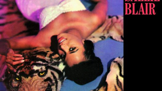 Poster for Salle Blair: a smiling woman in white atop a tiger rug with a tiger beside her, bold pink title on a black panel
