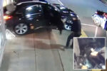 Surveillance image of a black SUV with its door open and a person standing near the driver's side on a sidewalk area outside a store.