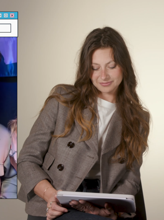 Three adults in a fashion studio: a man on a call in a left panel and two women in blazers reviewing documents to the right, StyleCaster logo visible.