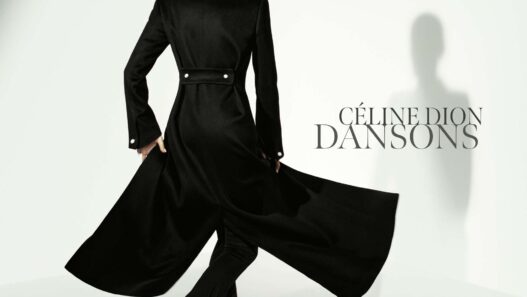Back view of a woman in a long black coat with a flowing cape against a pale background; 'CÉLINE DION DANSONS' text on the right.