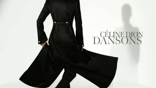 Back view of a woman in a long black coat with a flowing cape against a pale background; 'CÉLINE DION DANSONS' text on the right.