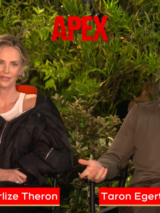 Two hosts sit in folding chairs outdoors among lush greenery, a bold red APEX logo above, as they speak in an ETalk interview segment with red name banners at the bottom (no names provided).