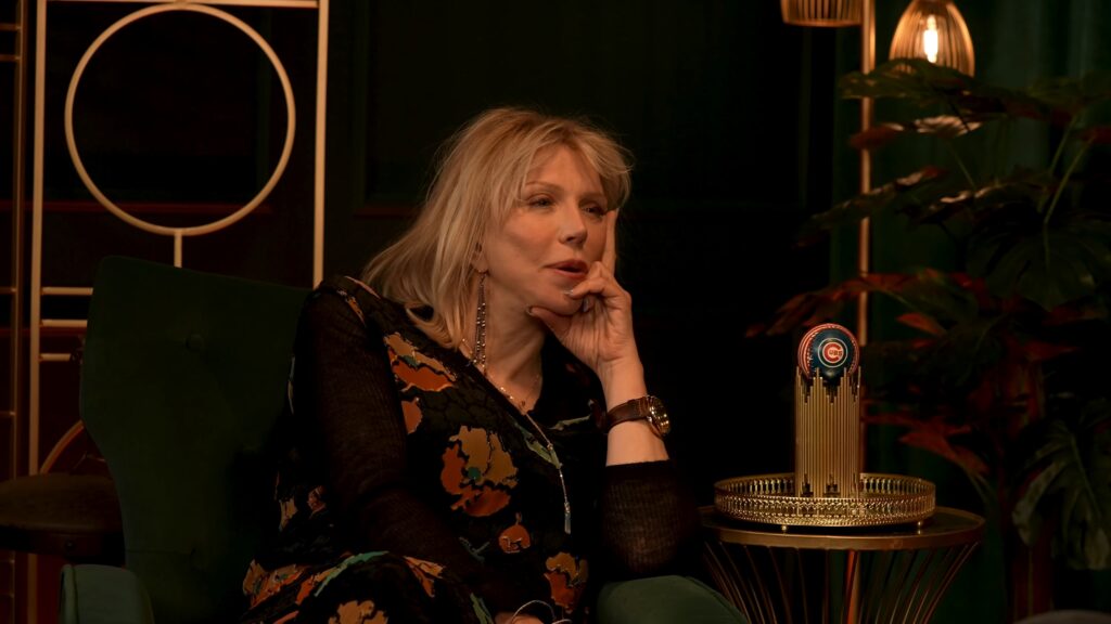 Close‑up of Courtney Love reflecting on her childhood and early career.