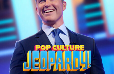 Poster for Netflix series Pop Culture Jeopardy! featuring a smiling host in a suit holding a game controller; includes Netflix branding and show timing text.