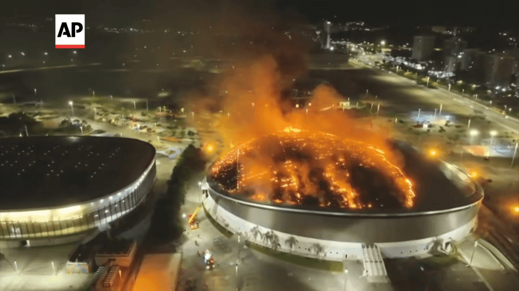 Firefighters battling flames at Rio’s Olympic Park Velodrome.