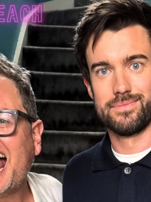 Two men smiling for a selfie in front of a stairwell, with a neon circular border and a pink airplane graphic in the corner.