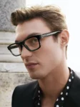 Close‑up of Kit Butler modeling D&G’s Spring–Summer 2026 eyewear.