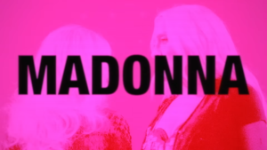 Poster-style image with the word MADONNA in large black letters over a pink-tinted photo of two people.
