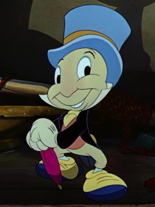 Cheerful Pinocchio-like cartoon boy in a blue hat and yellow shoes, smiling and pointing, while holding a pink umbrella.