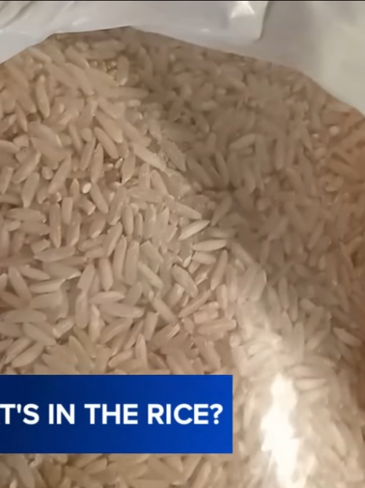 Close-up of a bag of uncooked white rice held in a plastic bag, with a blue ABC7 On Your Side banner reading 'WHAT'S IN THE RICE?'
