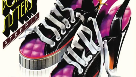 Album cover for The Pointer Sisters' 'Steppin'' showing pink and black sneakers with white laces and bold band text.