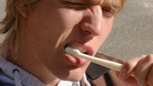 Model Oskar Ø in a clean urban portrait photographed by Andrea Brandt.