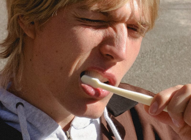 Model Oskar Ø in a clean urban portrait photographed by Andrea Brandt.
