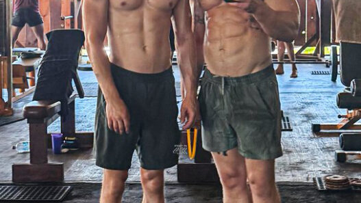 Miles Heizer and Angus O’Brien posing during a gym workout shared on Instagram Stories.