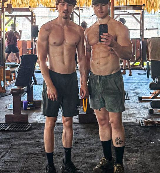 Miles Heizer and Angus O’Brien posing during a gym workout shared on Instagram Stories.