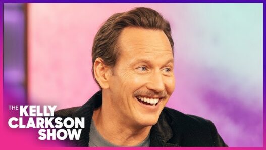 Patrick Wilson and Kelly Clarkson sharing a laugh on The Kelly Clarkson Show.