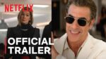 Netflix Official Trailer banner showing a woman in black on the left and a smiling man in sunglasses on the right.