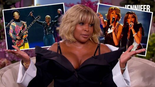 Talk-show host seated on a sofa with two inset photos of musicians performing in the background.