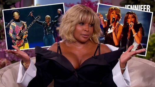 Talk-show host seated on a sofa with two inset photos of musicians performing in the background.