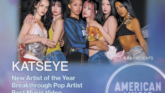 Poster advertising the American Music Awards with six women posing together; large NOMINEE text at the top and Katseye highlighted as New Artist of the Year nominee.