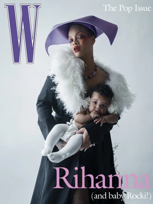 Rihanna wearing a purple hat and a white feathered scarf, holding her baby on a W magazine cover.
