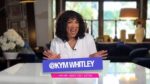 Kym Whitley testing a viral vacuum‑seal travel bag on her Gadget Girly series.