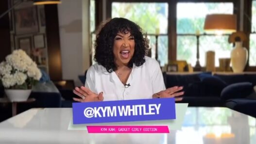 Kym Whitley testing a viral vacuum‑seal travel bag on her Gadget Girly series.