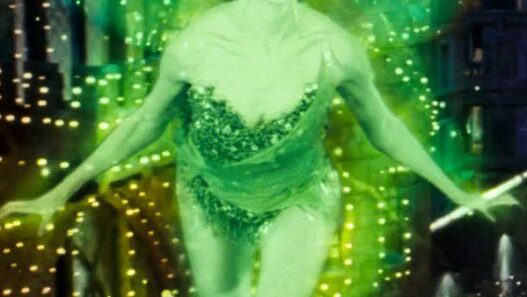 Kylie Minogue as The Green Fairy in Baz Luhrmann’s Moulin Rouge! shimmering in emerald light.