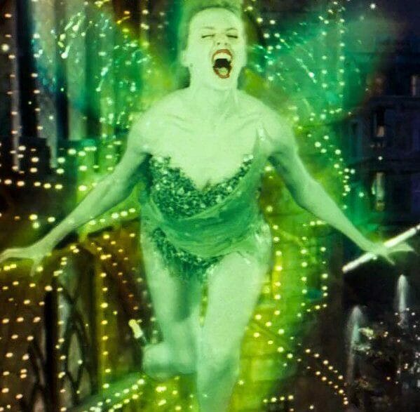 Kylie Minogue as The Green Fairy in Baz Luhrmann’s Moulin Rouge! shimmering in emerald light.