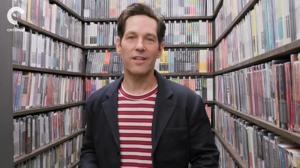 Paul Rudd holding films inside the Criterion Closet