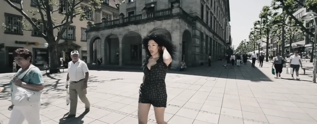 Dacia Bridges in a scene from the official I Begin To Wonder music video