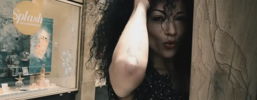 Official I Begin To Wonder video still featuring Dacia Bridges