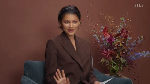 Zendaya reflecting on her fashion archive during ELLE Clothes of Our Lives