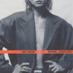 Album cover for Anabel Englund's 'Get Busy' featuring a person in an oversized gray blazer with an orange band across the chest.