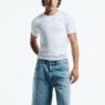 Morgan Sahadow photographed by Alexandra Nataf wearing Calvin Klein denim and a classic cotton T-shirt