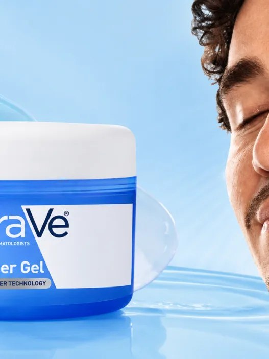 CeraVe Hydrating HA Water Gel jar with a model applying gel moisturizer against a soft blue skincare background.