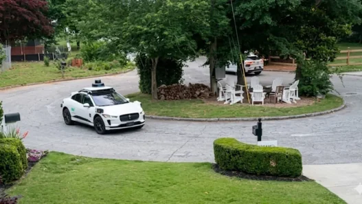 Empty Waymo robotaxi circling an Atlanta neighborhood during a driverless malfunction.