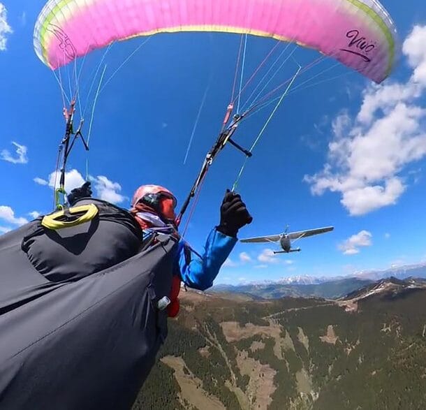 Paraglider moments before surviving a midair collision with a small plane in the Austrian Alps