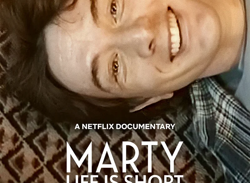 Netflix documentary poster showing a smiling man lying on a patterned rug, with the title 'MARTY LIFE IS SHORT' prominently displayed.