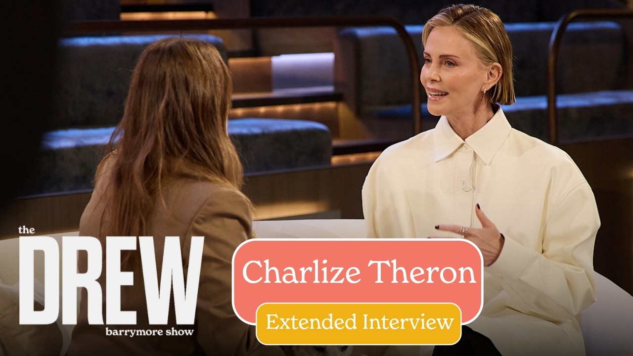 Two women converse on a TV interview set, with a large 'DREW' logo on the left and a peach/yellow overlay announcing an extended interview with the guest.