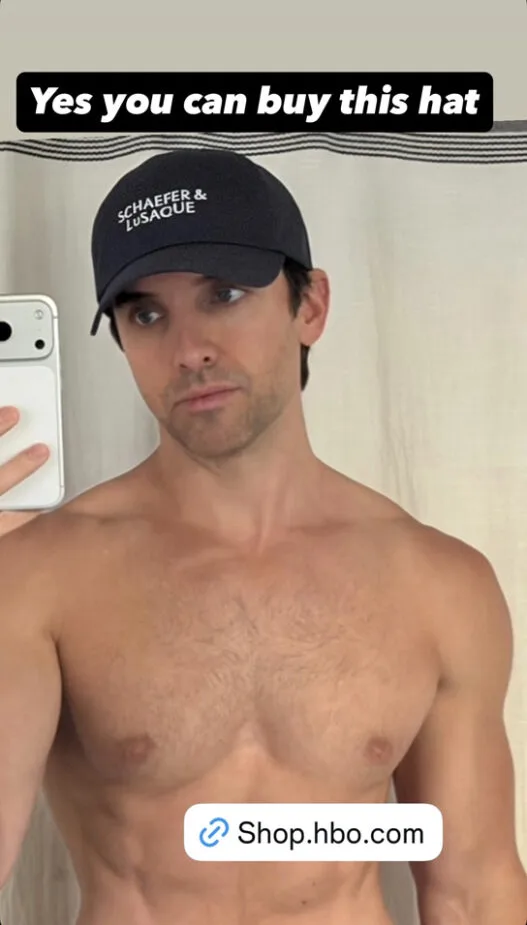 Paul W. Downs posing shirtless in a playful Instagram moment.