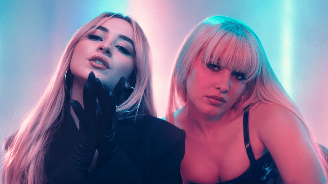 Zara Larsson and Sabrina Carpenter posed together in a neon pink and blue pop-video inspired header image for their “WOW” remix collaboration.