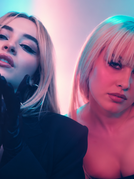 Zara Larsson and Sabrina Carpenter posed together in a neon pink and blue pop-video inspired header image for their “WOW” remix collaboration.