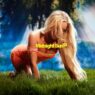 Zara Larsson kneels in the grass wearing an orange dress on the colorful Midnight Sun artwork