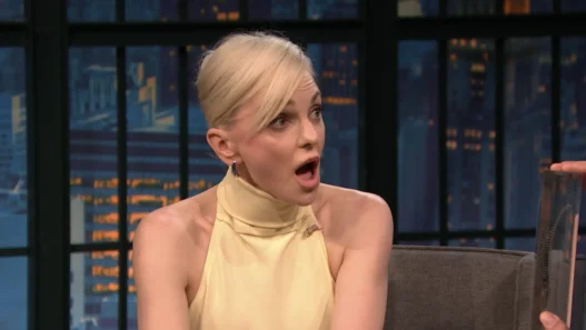 Anna Faris laughing during her Late Night with Seth Meyers interview about Scary Movie and her anonymous YouTube comments.
