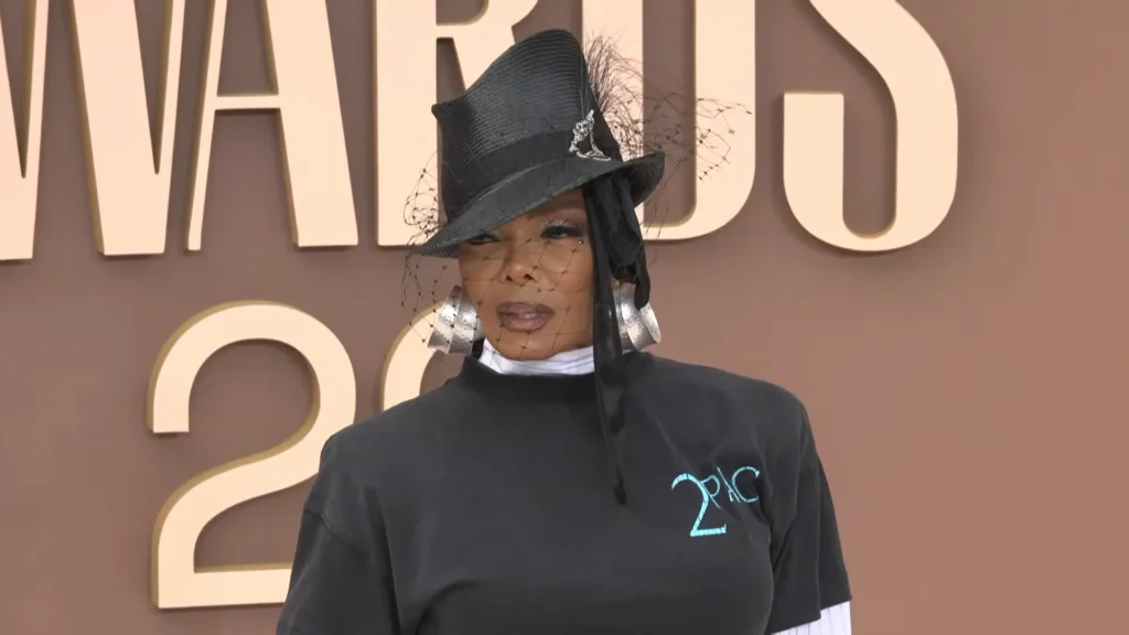 Janet Jackson smiling on the BET Awards 2026 carpet in a Tupac Shakur T-shirt