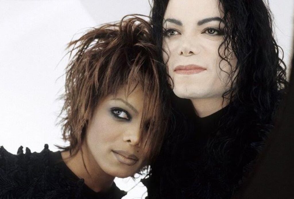 Janet Jackson leaning against Michael Jackson during the futuristic Scream video era