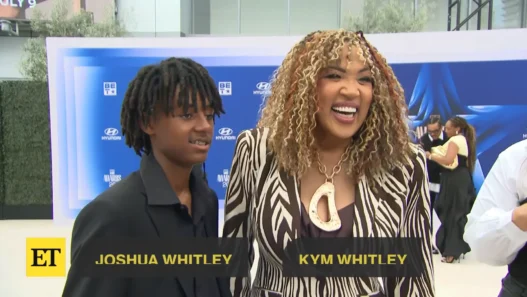 Kym Whitley with her son Joshua during a BET Awards carpet interview about the Martin spinoff